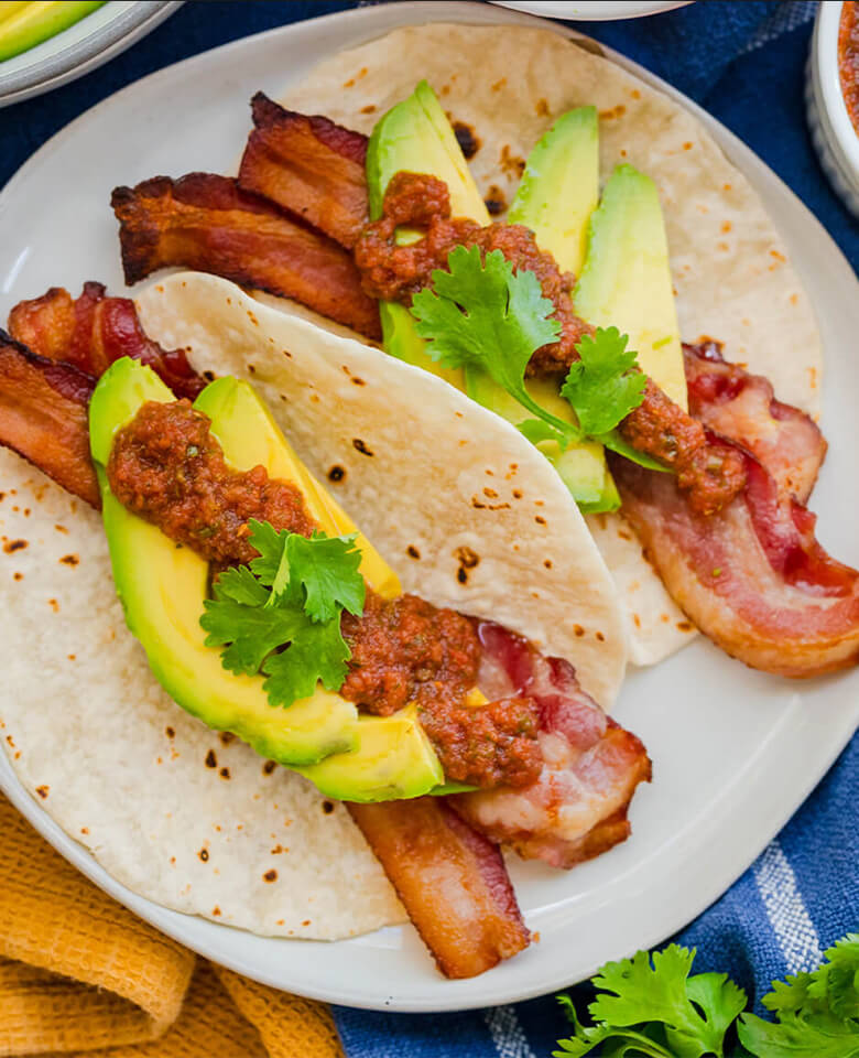 Bacon and avocado tacos topped with Gramal’s Chilie Salsa.