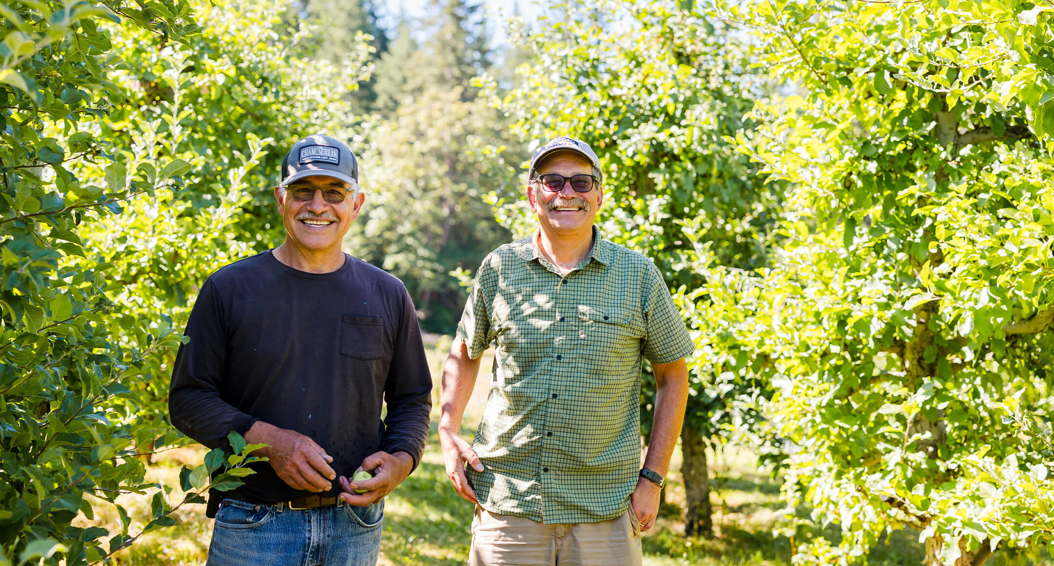 Farmers Salvador and Sal of Cinagro Orchards grow the local, organic apples and pears you'll find at New Seasons Market. 