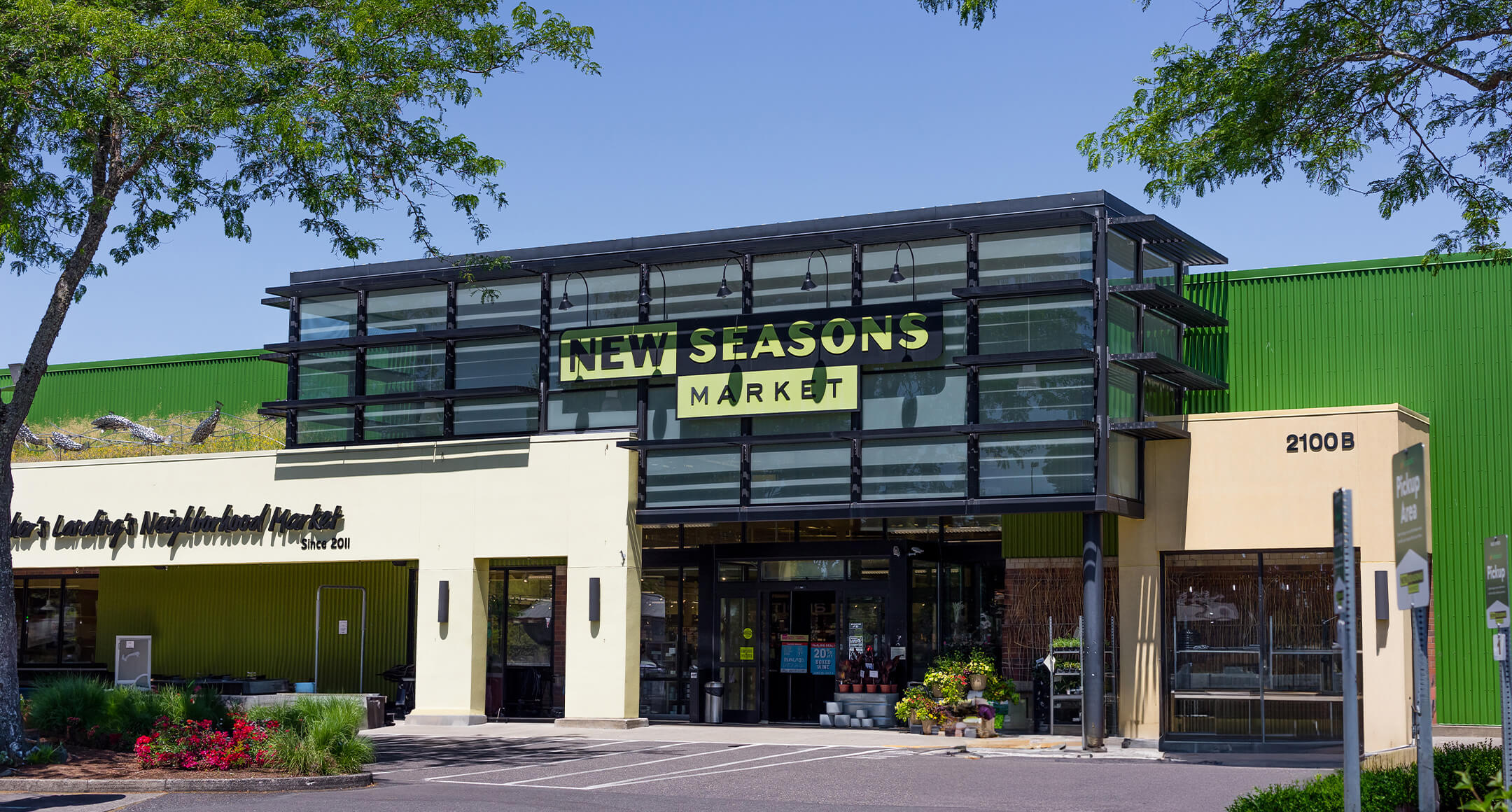 A photo showing the front entrance to New Seasons Fisher’s Landing location.