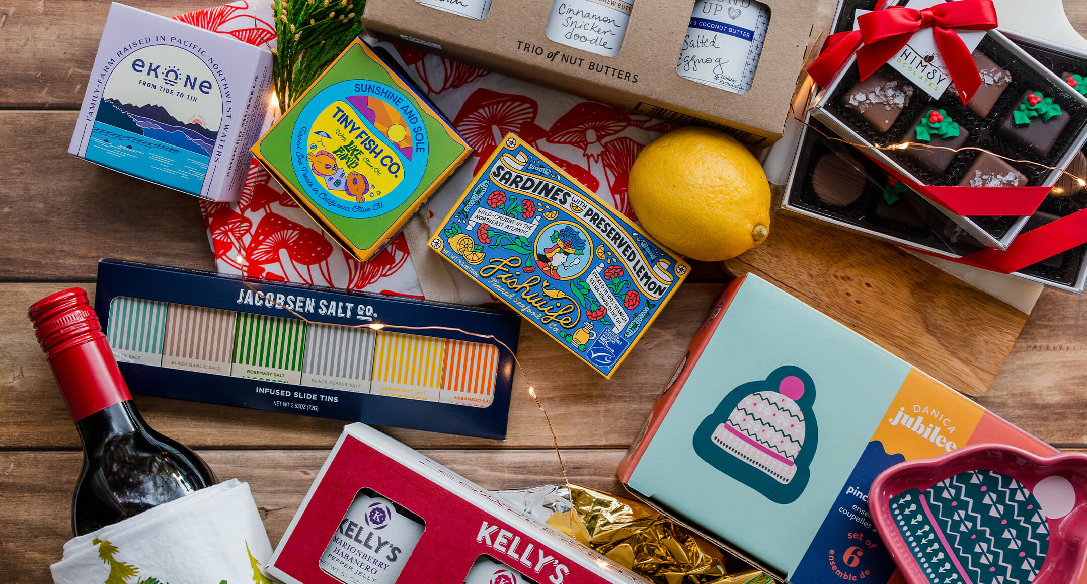 Foodie gifts, including tinned fish, wine, and chocolates.