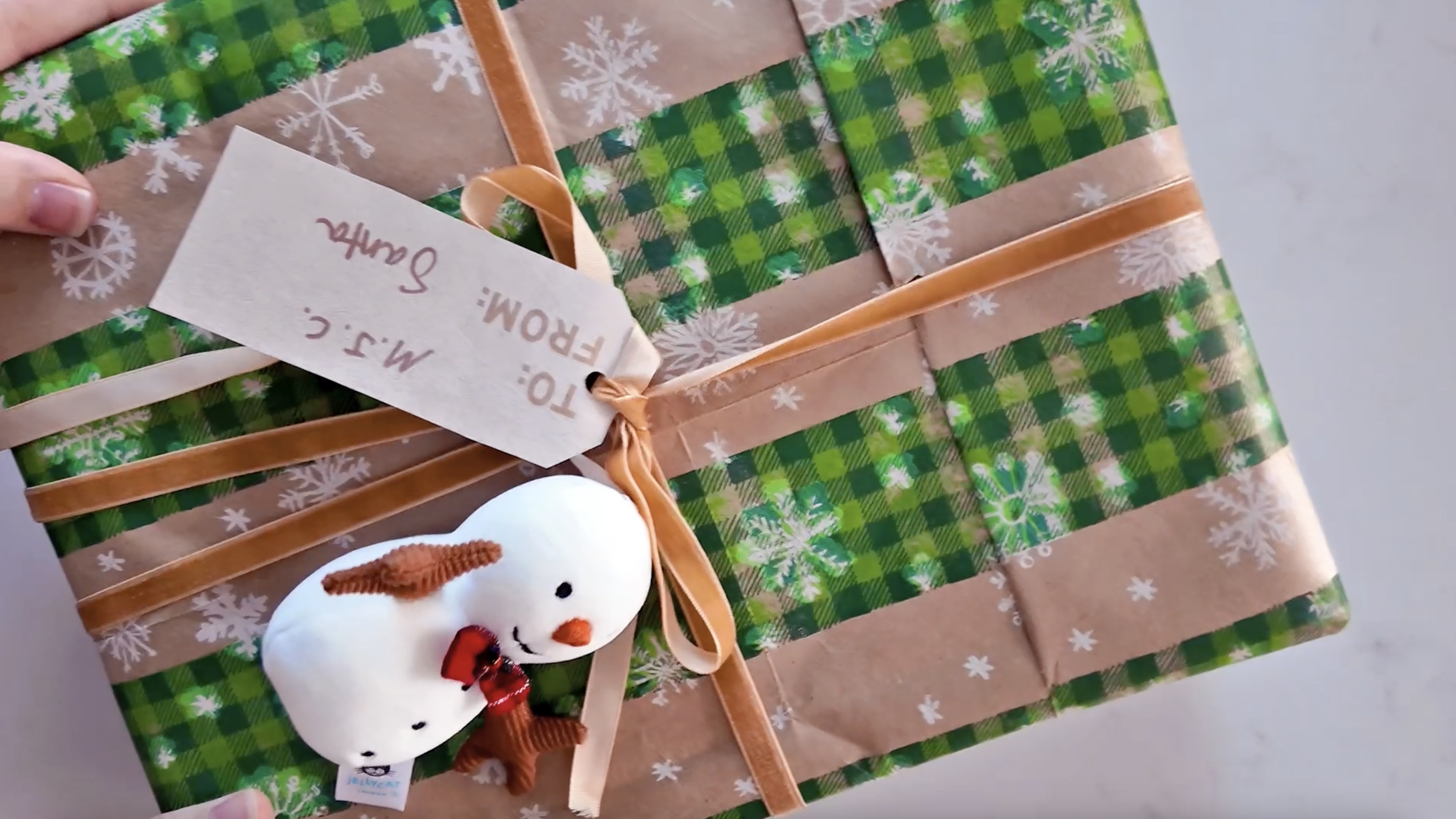 a gift wrapped with barrel bag paper 