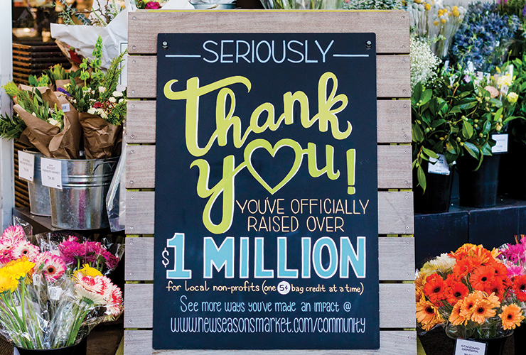 Hand illustrated chalk art says Thank You for raising over $1 Million