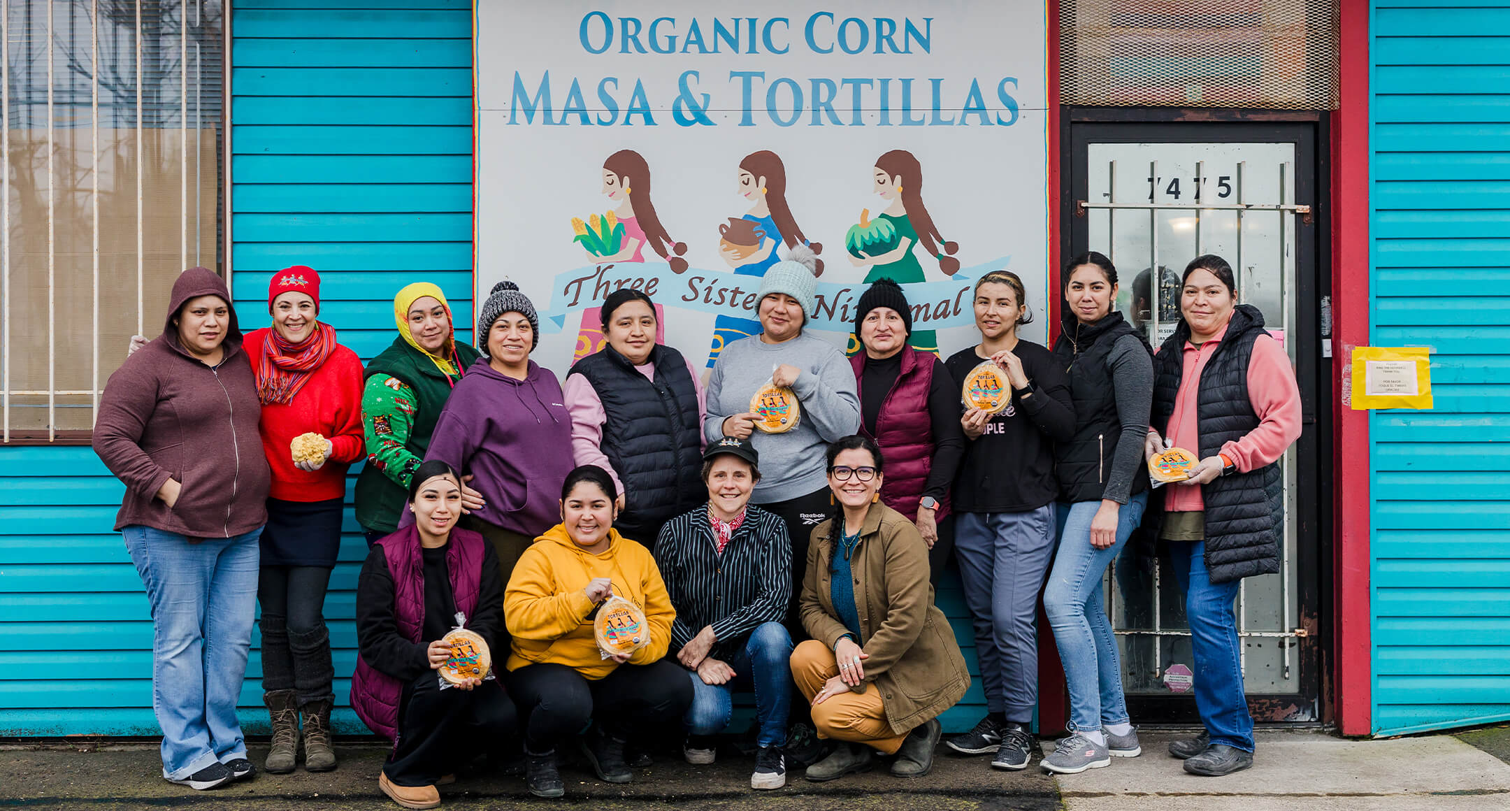 The team at Three Sister Nixtamal posing in front of the business.