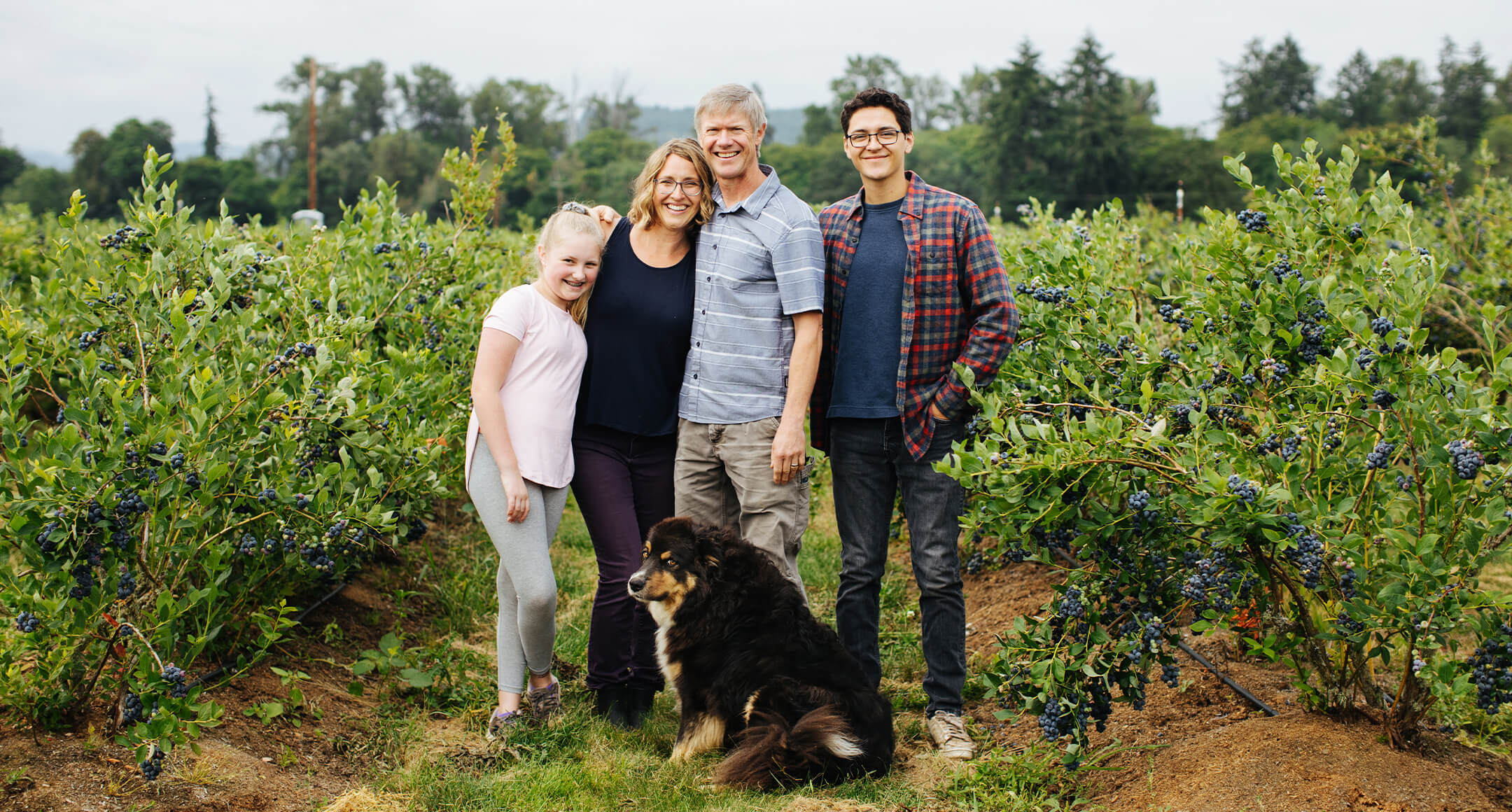 An image of the O’Driscoll family on their blueberry farm in Oregon.